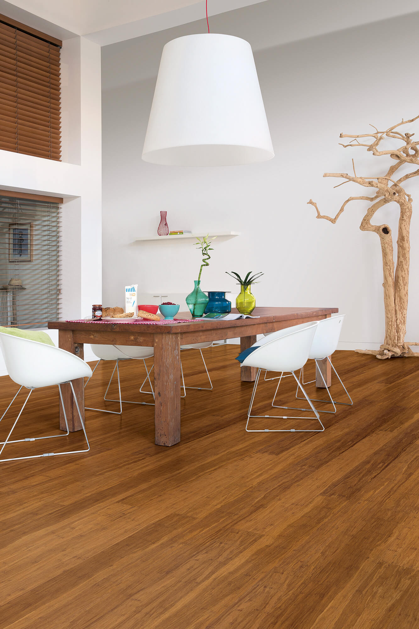 Dining room with wooden table and chairs on a wooden floor