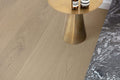 Wooden floor with a gold side table and marble surface