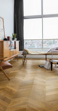 Living room with wooden floor, furniture, and large window