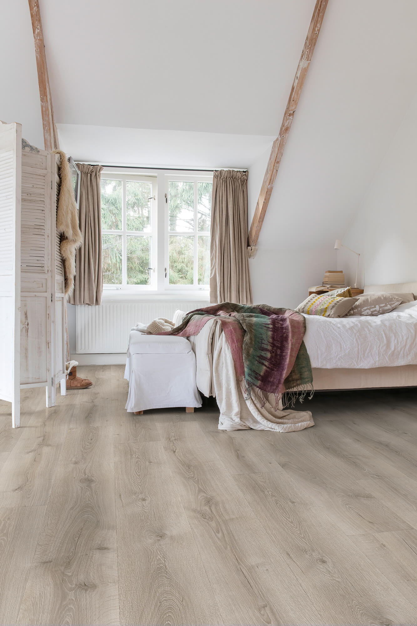 Bedroom with wooden flooring, bed, and window