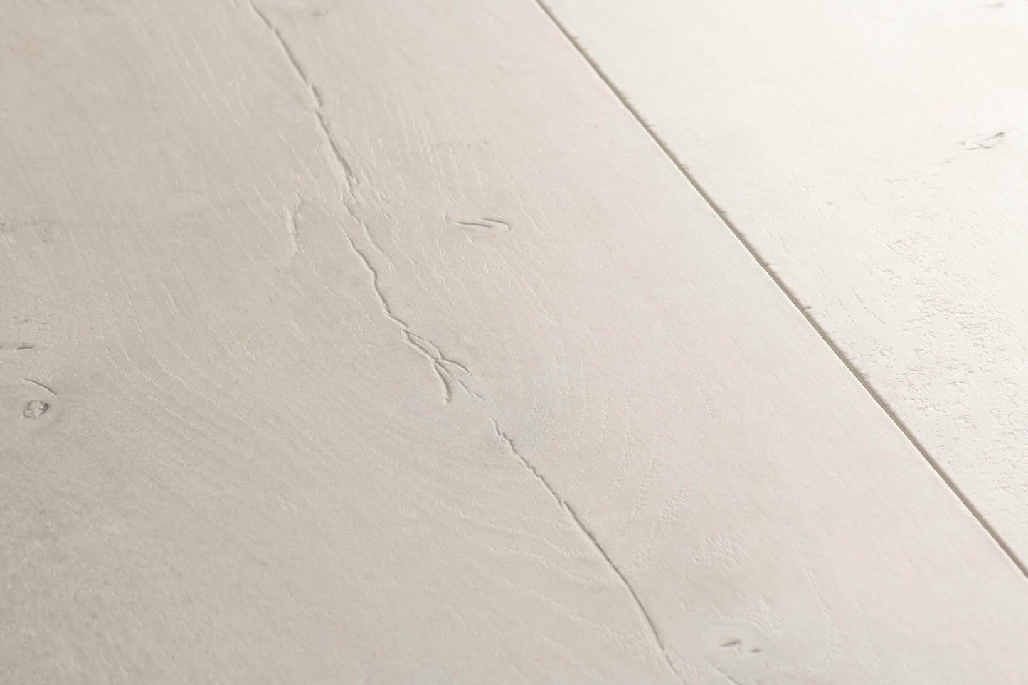 Close-up of a light gray ceramic tile with subtle texture