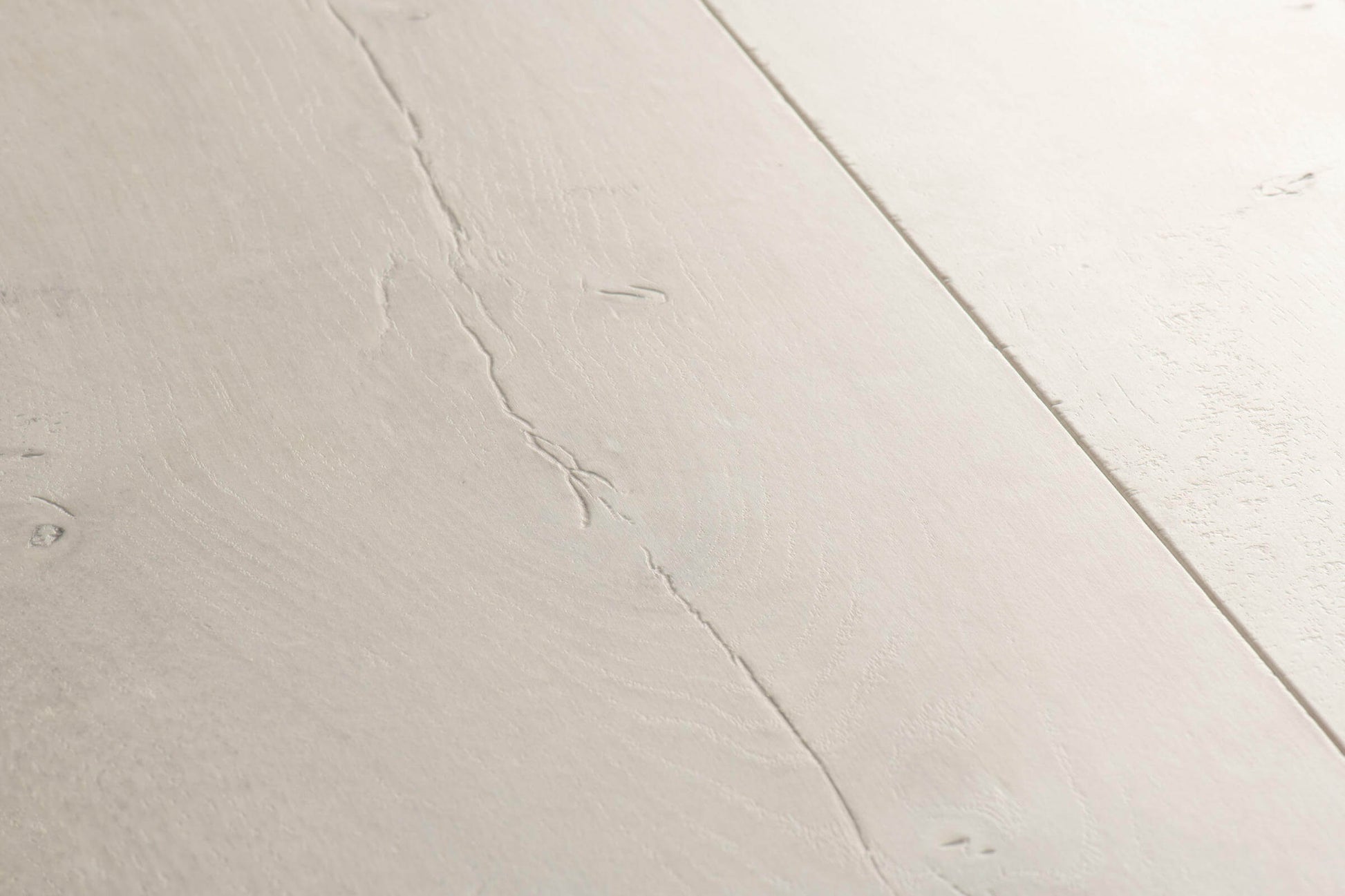 Close-up of a light gray ceramic tile with subtle texture