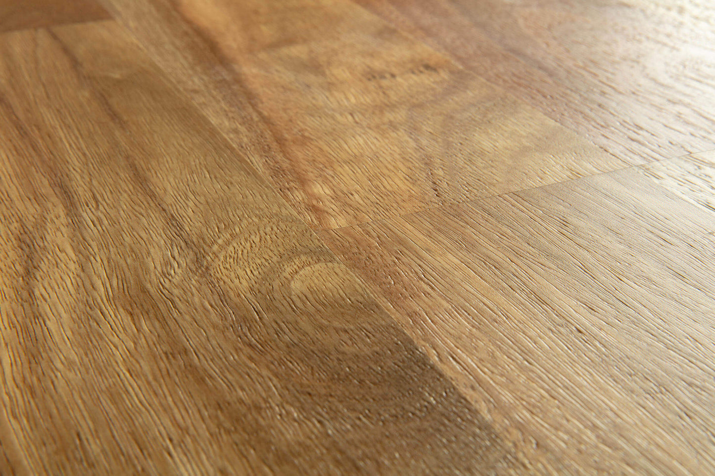 Close-up of a wooden floor with a warm brown color.