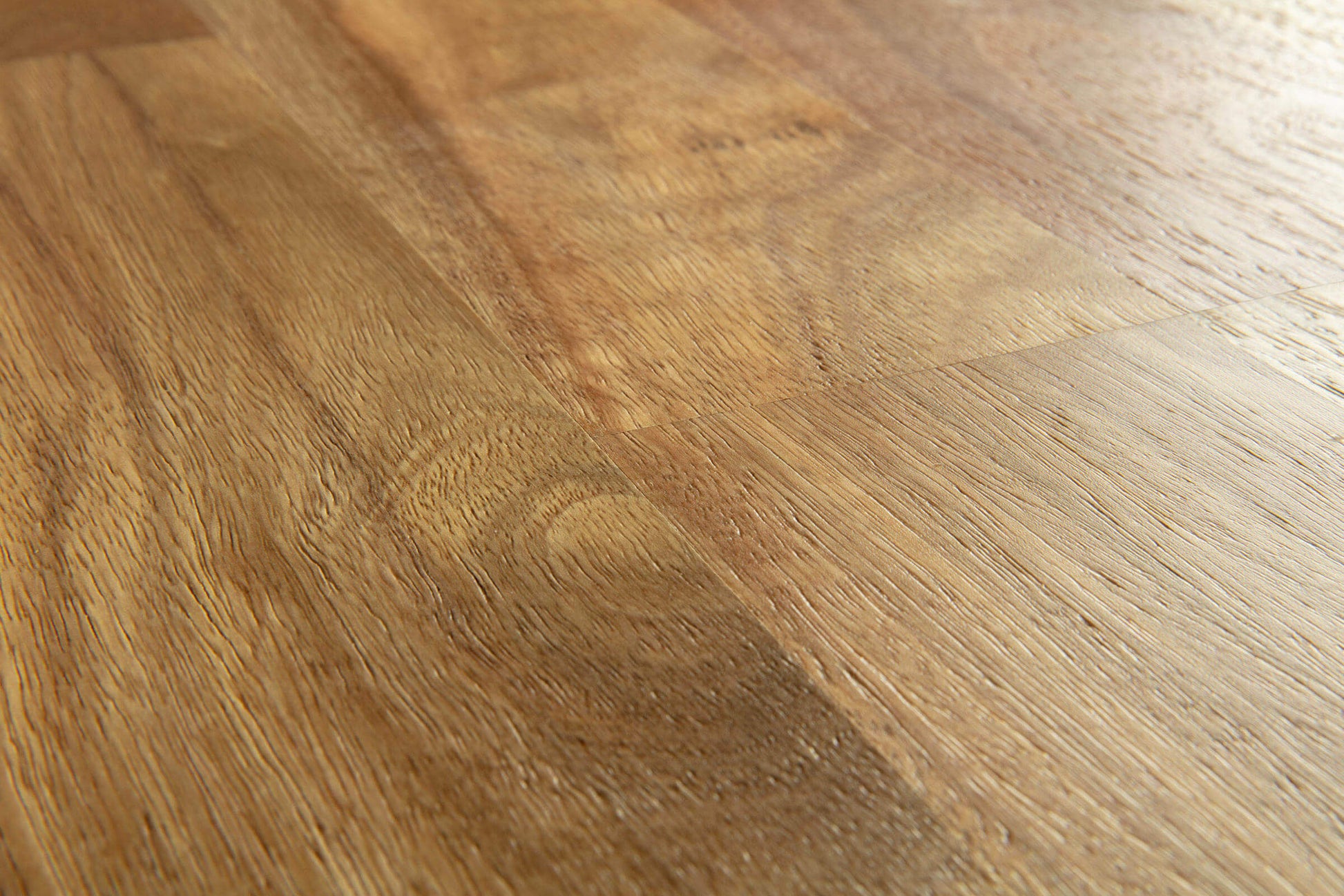 Close-up of a wooden floor with a warm brown color.