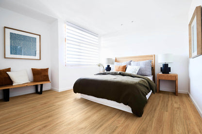 Modern bedroom with wooden floor, bed, and decor